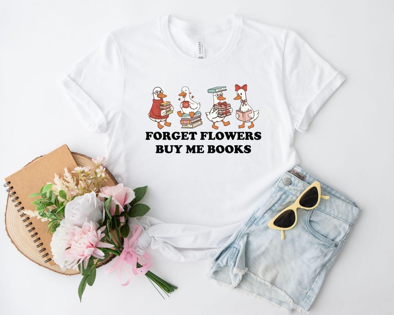A gildan 18000 sweatshirt with the saying "Forget flowers buy me books"
