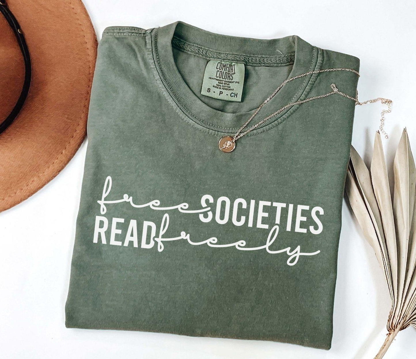 A comfort colors shirt with the saying "Free societies read freely"