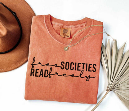 A comfort colors shirt with the saying "Free societies read freely"
