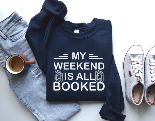 A navy color sweatshirt with the saying "My weekend is all booked"