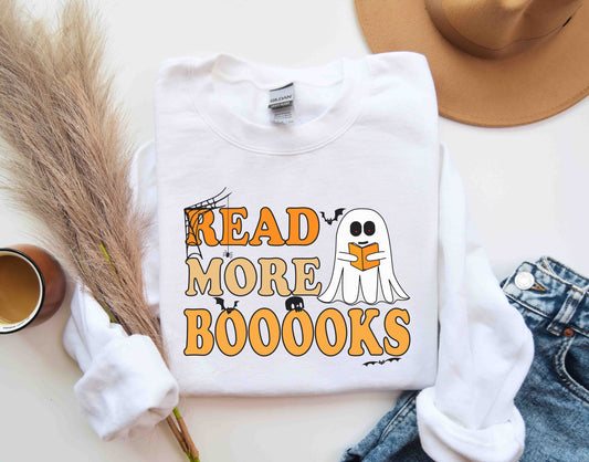 A white color sweatshirt with the saying "Read more boooks"