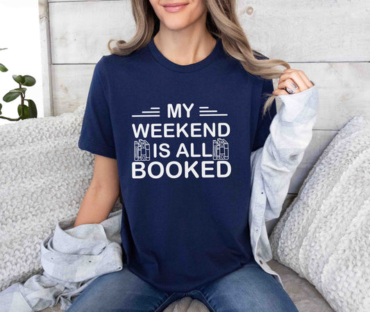 A navy color shirt with the saying "My weekend is all booked"