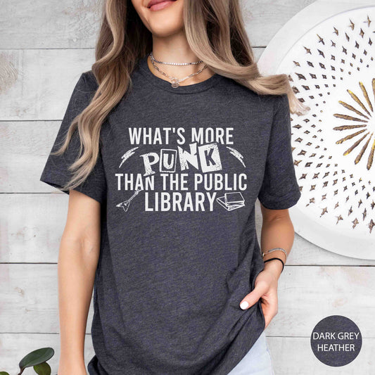 Person wearing a dark grey t-shirt with a humorous quote about the public library.