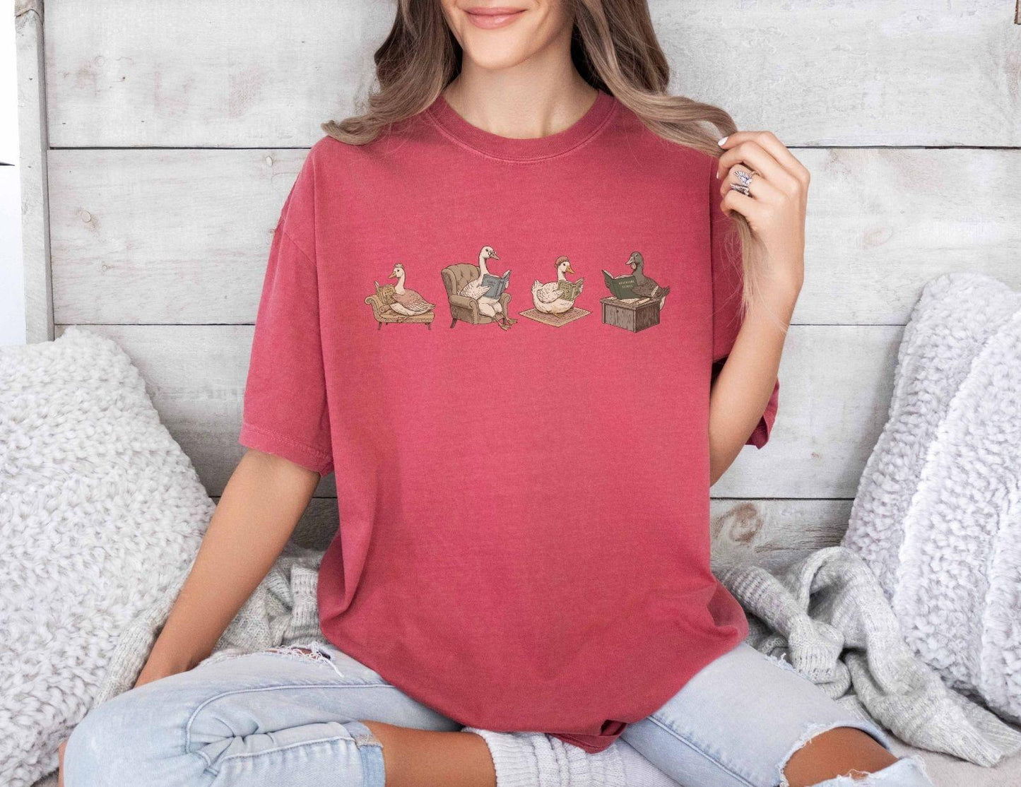 A comfort colors® shirt with the saying "goose reading a book"