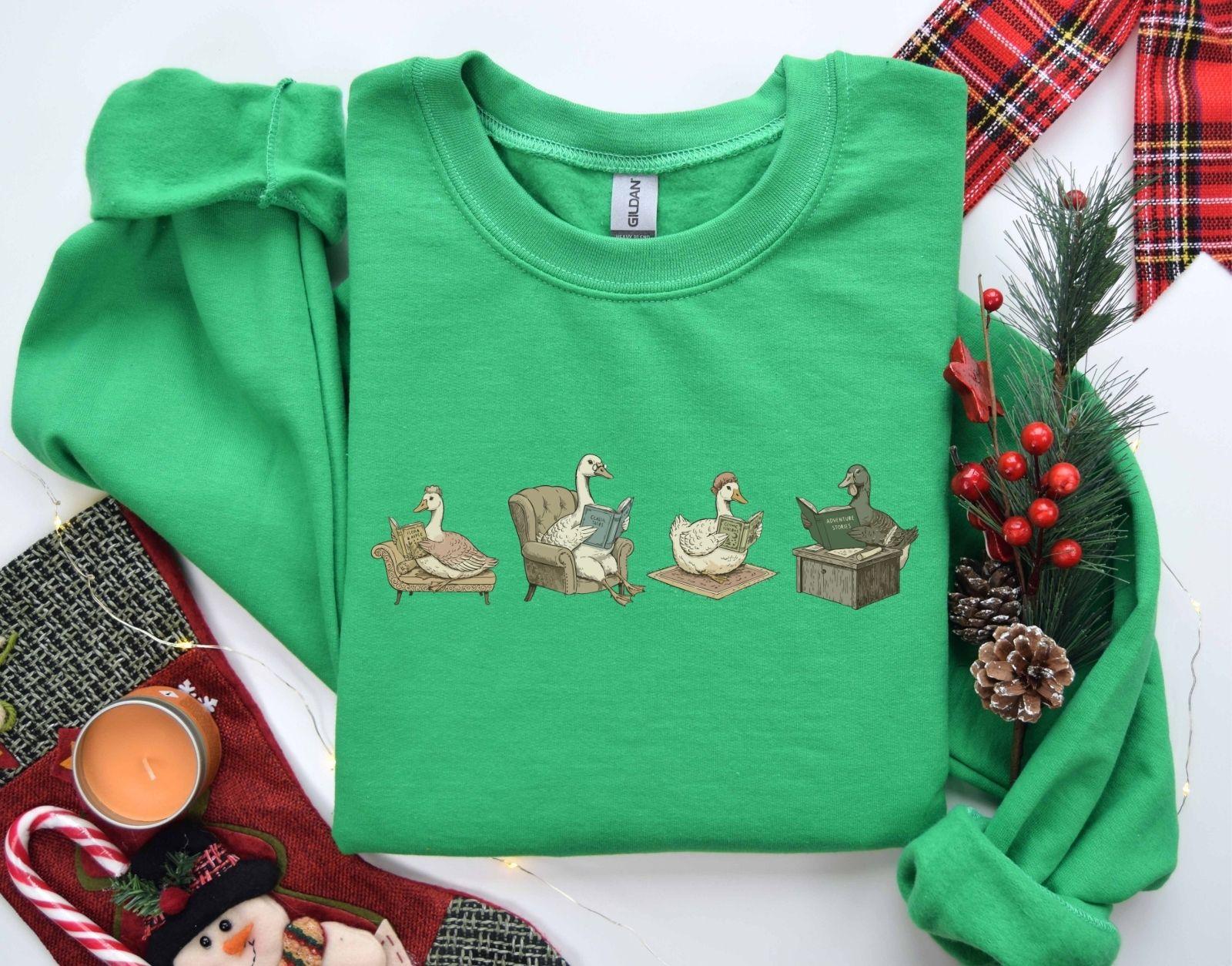 A Gildan 18000 sweatshirt with the saying "goose reading a book"