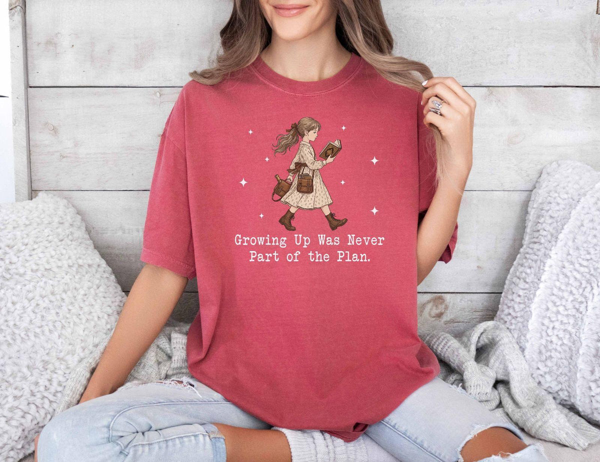 A comfort colors® shirt with the saying "Growing Up Was Never Part of the Plan "