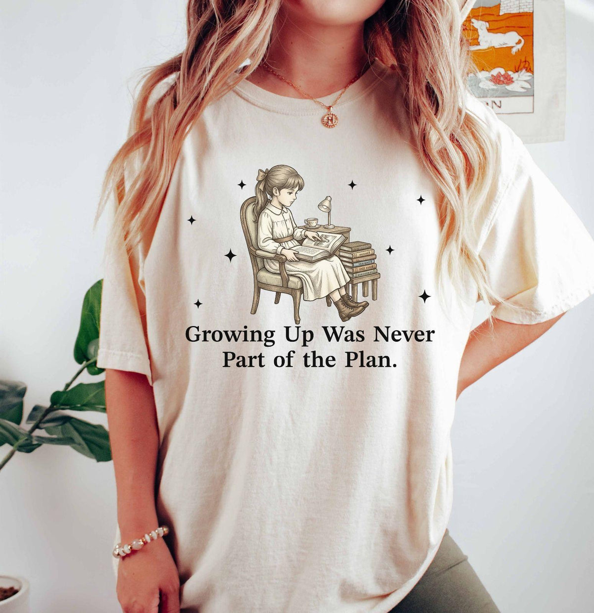 A comfort colors® shirt with the saying "Growing Up Was Never Part of the Plan"