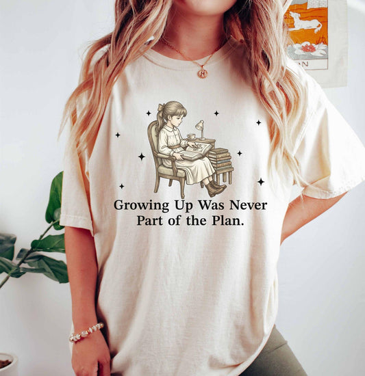 A comfort colors® shirt with the saying "Growing Up Was Never Part of the Plan"