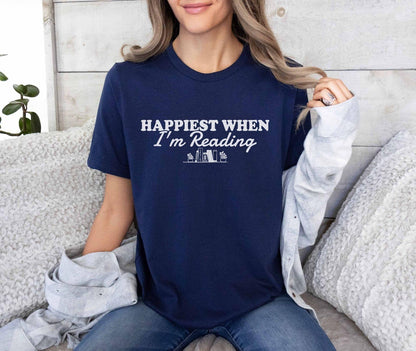 A bella canvas 3001 shirt with the saying "happiest when i'm reading"