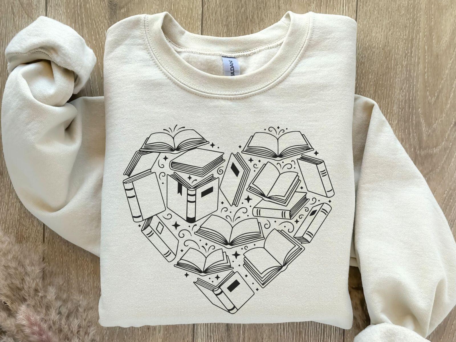 A Gildan 18000 sweatshirt with the saying "heart made of books"