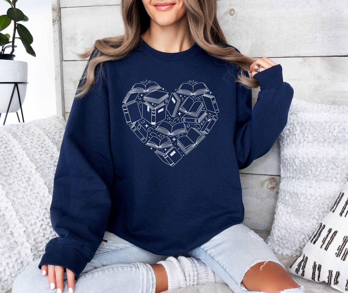 A Gildan 18000 sweatshirt with the saying "heart made of books"
