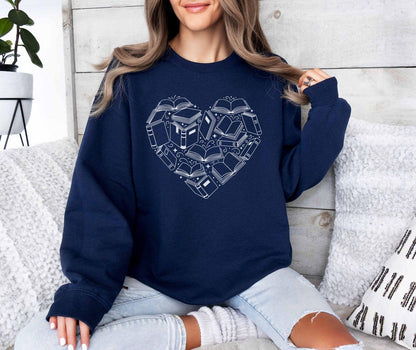 A Gildan 18000 sweatshirt with the saying "heart made of books"