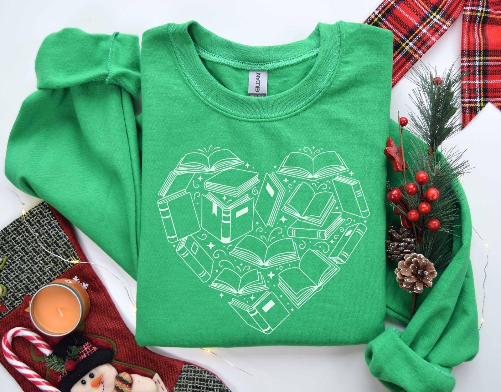 A Gildan 18000 sweatshirt with the saying "heart made of books"