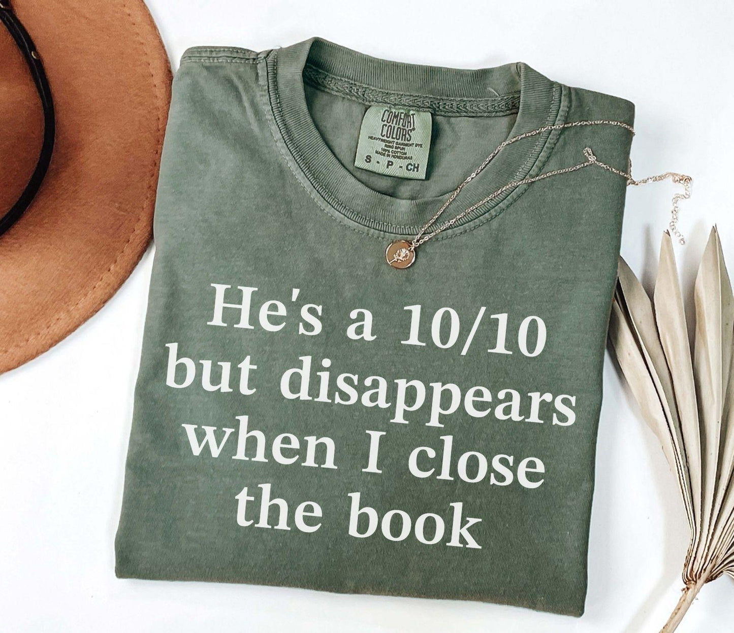 A comfort colors® shirt with the saying "he's a 10/10 but disappears when i close the book"