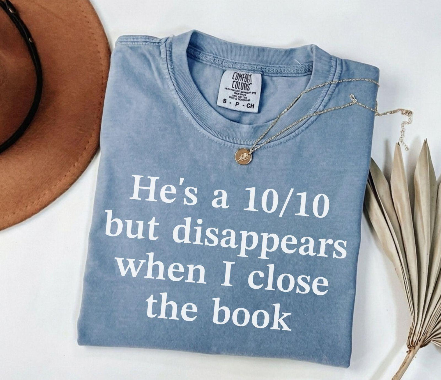 A comfort colors® shirt with the saying "he's a 10/10 but disappears when i close the book"