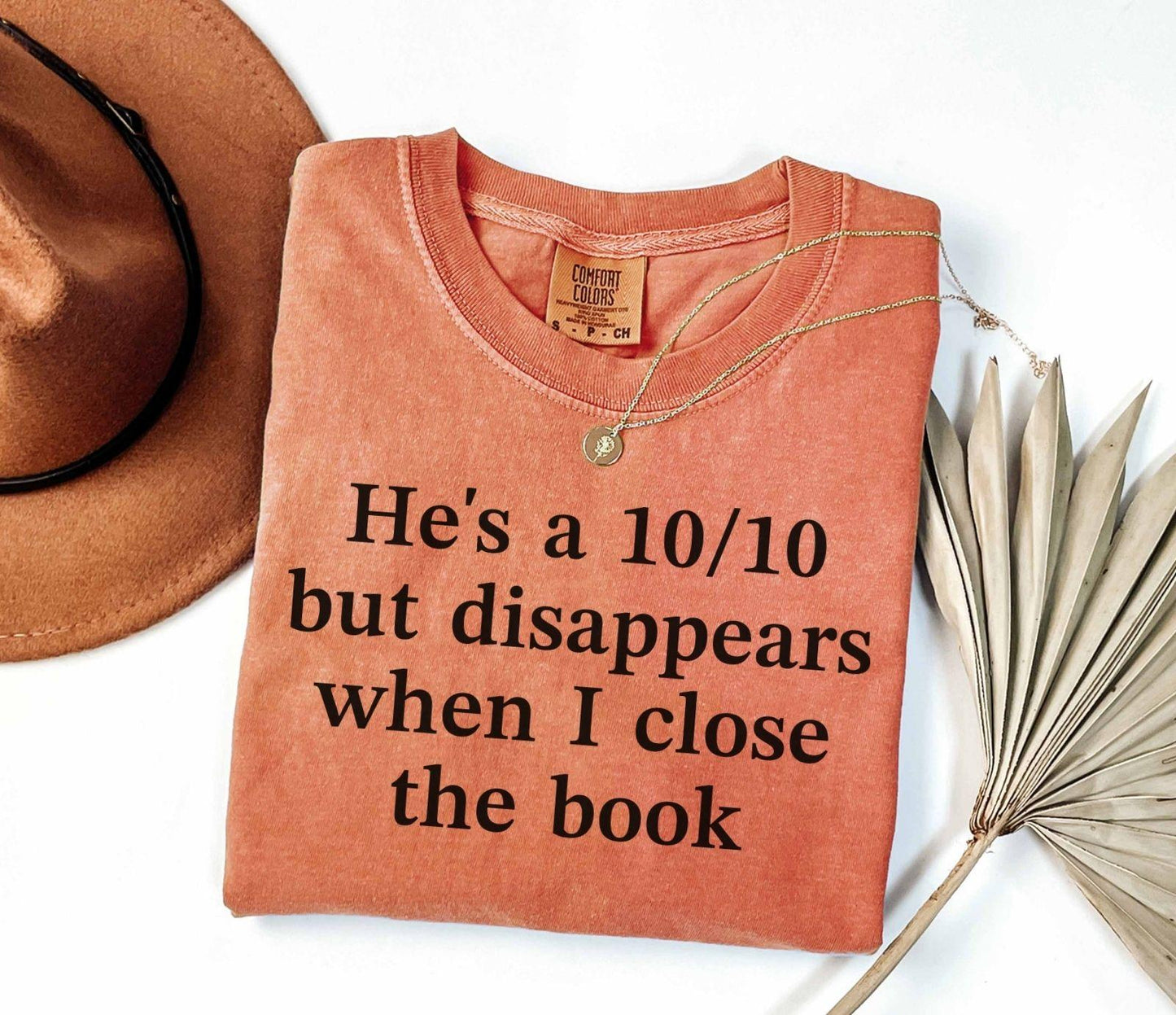 A comfort colors® shirt with the saying "he's a 10/10 but disappears when i close the book"