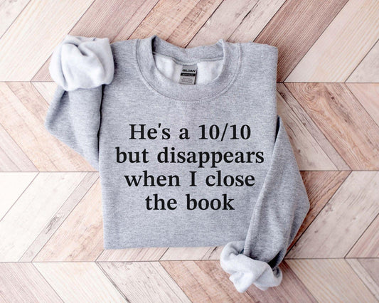 A Gildan 18000 sweatshirt with the saying "he's a 10/10 but disappears when i close the book"