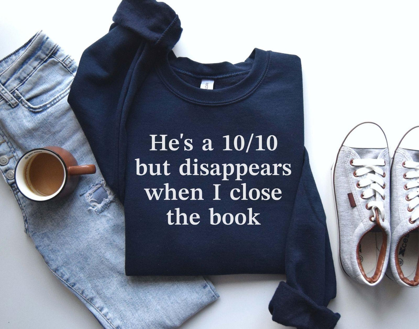 A Gildan 18000 sweatshirt with the saying "he's a 10/10 but disappears when i close the book"