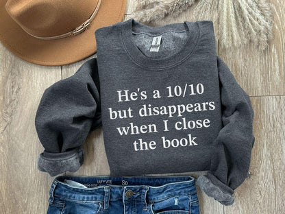 A Gildan 18000 sweatshirt with the saying "he's a 10/10 but disappears when i close the book"