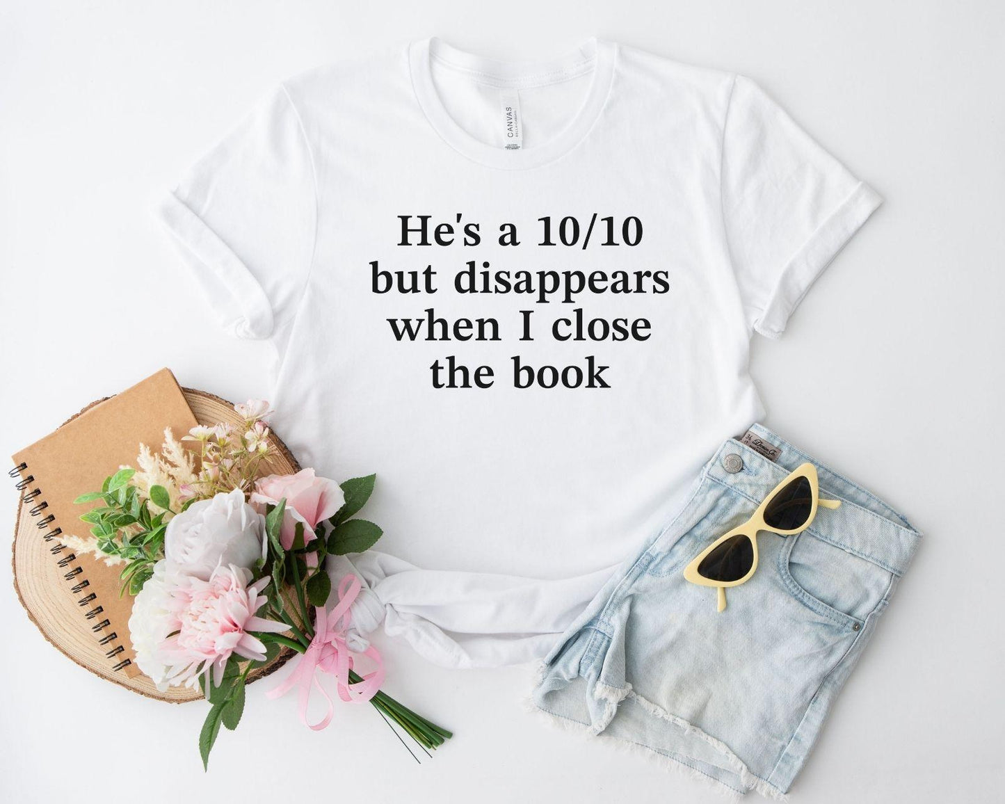 A bella canvas 3001 shirt with the saying "he's a 10/10 but disappears when i close the book"