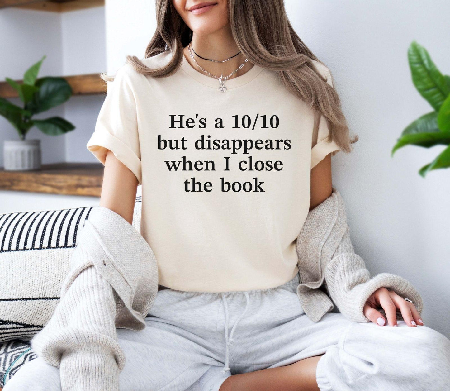 A bella canvas 3001 shirt with the saying "he's a 10/10 but disappears when i close the book"