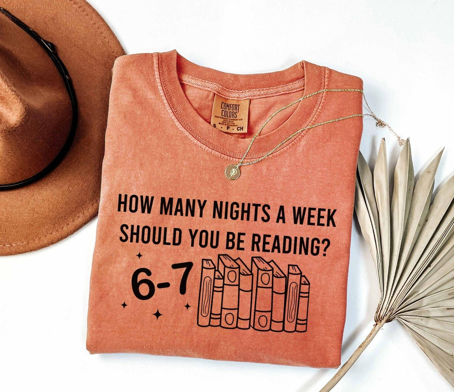 A comfort colors shirt with the saying " How Many Nights A Week Should You Be Reading 6-7"