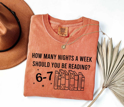 A comfort colors shirt with the saying " How Many Nights A Week Should You Be Reading 6-7"