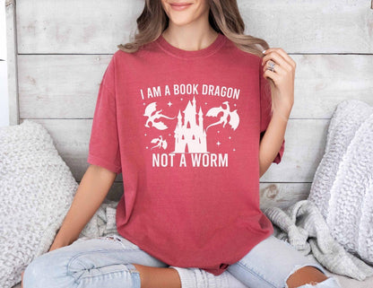 A comfort colors shirt with the saying "I am a book dragon not a work"