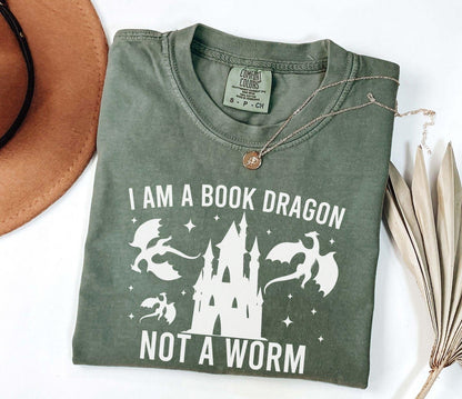 A comfort colors shirt with the saying "I am a book dragon not a work"