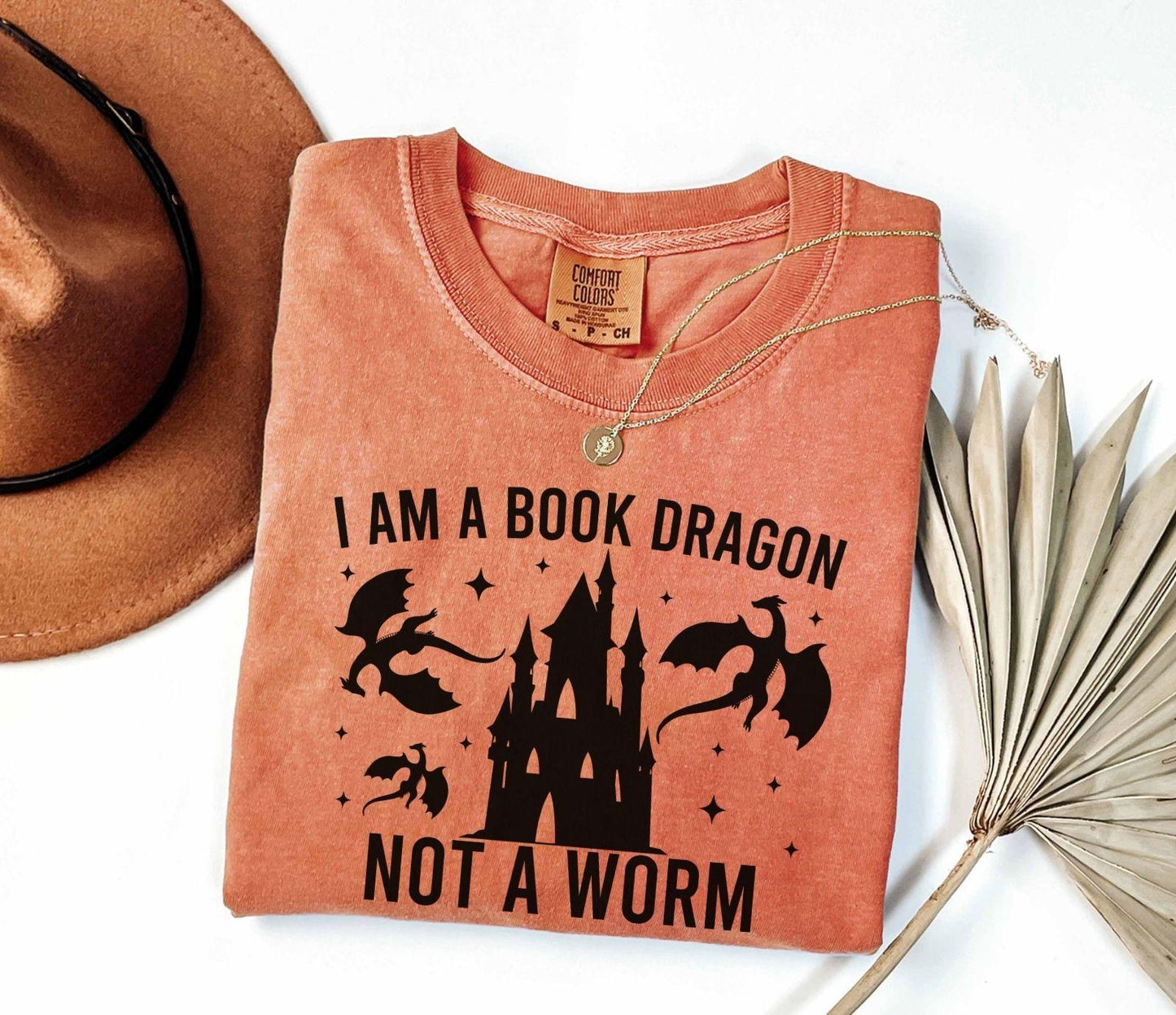 A comfort colors shirt with the saying "I am a book dragon not a work"