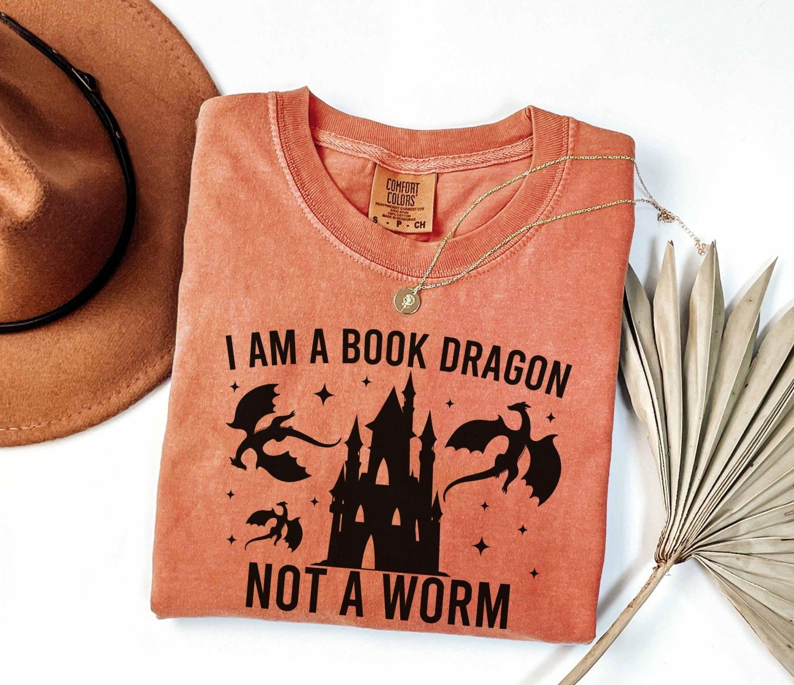 A comfort colors shirt with the saying "I am a book dragon not a work"
