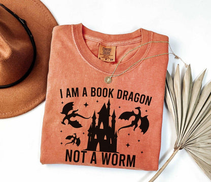 A comfort colors shirt with the saying "I am a book dragon not a work"