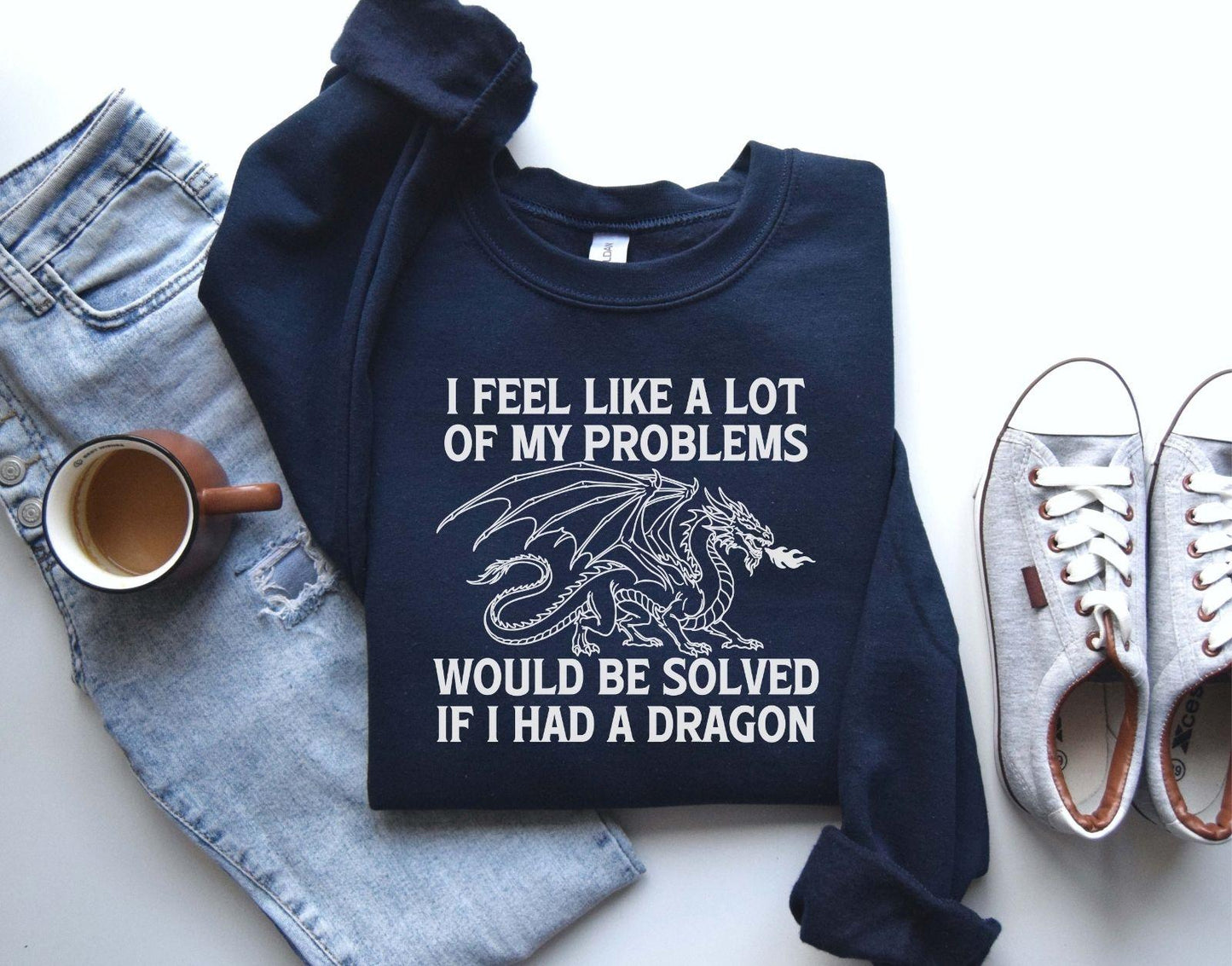 A Gildan 18000 sweatshirt with the saying "I feel like a lot of my problems would be solved if I had a dragon"
