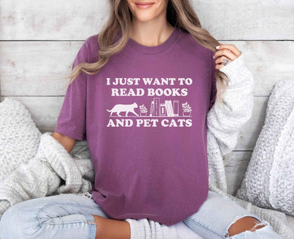 A comfort colors shirt with the saying "I just want to read books and pet cats"