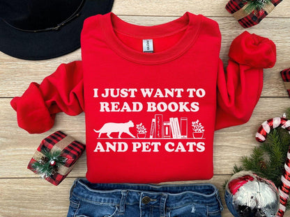 A comfort colors shirt with the saying "I just want to read books and pet cats"