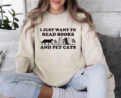 A comfort colors shirt with the saying "I just want to read books and pet cats"