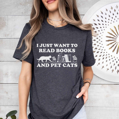 A comfort colors shirt with the saying "I just want to read books and pet cats"