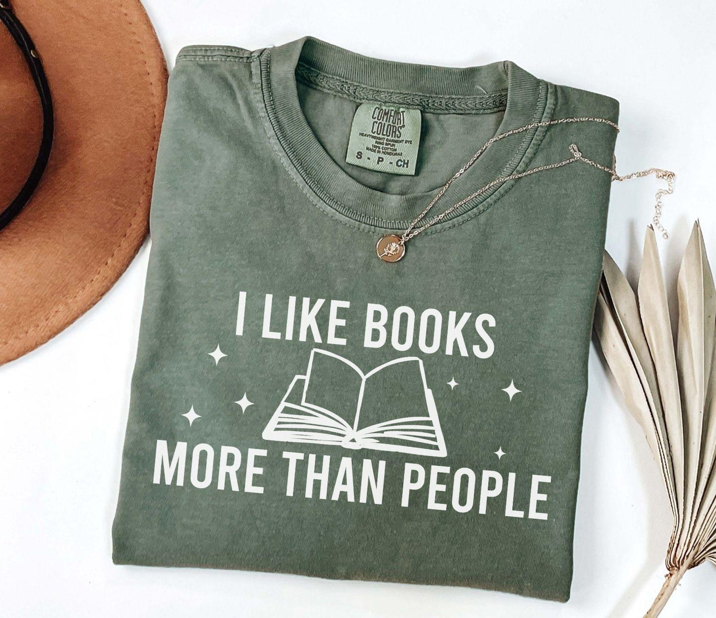 A comfort colors® shirt with the saying "I like books more than people"