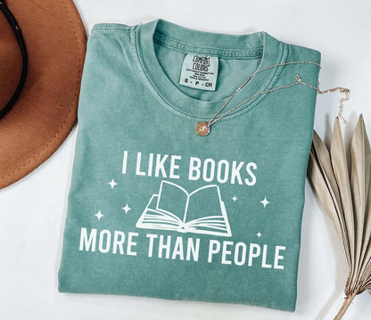 A comfort colors® shirt with the saying "I like books more than people"