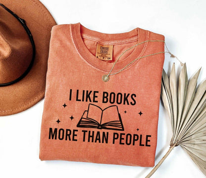 A comfort colors® shirt with the saying "I like books more than people"