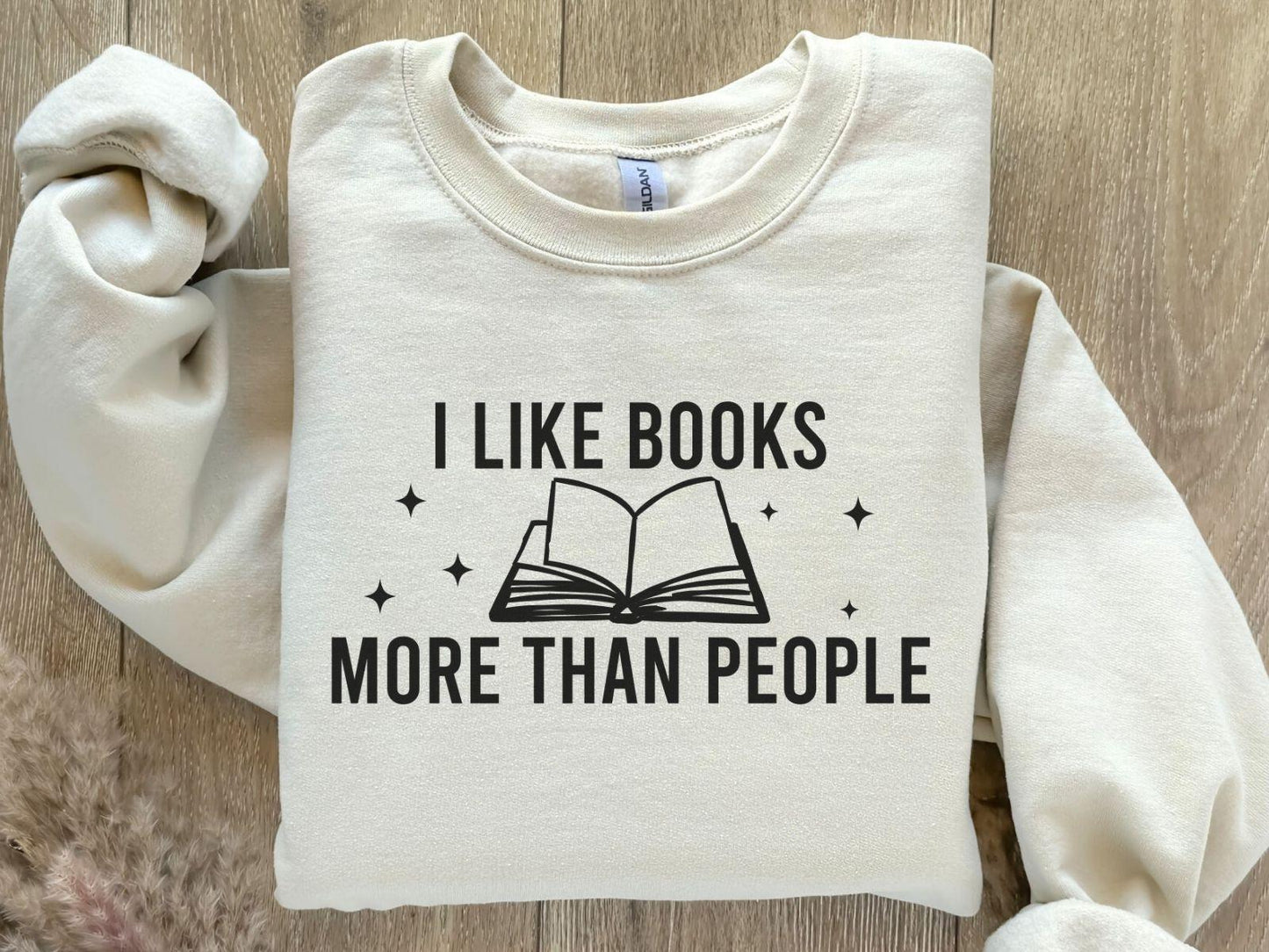 A Gildan 18000 sweatshirt with the saying "I like books more than people"
