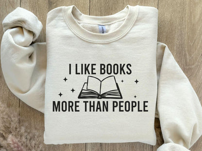A Gildan 18000 sweatshirt with the saying "I like books more than people"