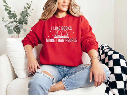 A Gildan 18000 sweatshirt with the saying "I like books more than people"