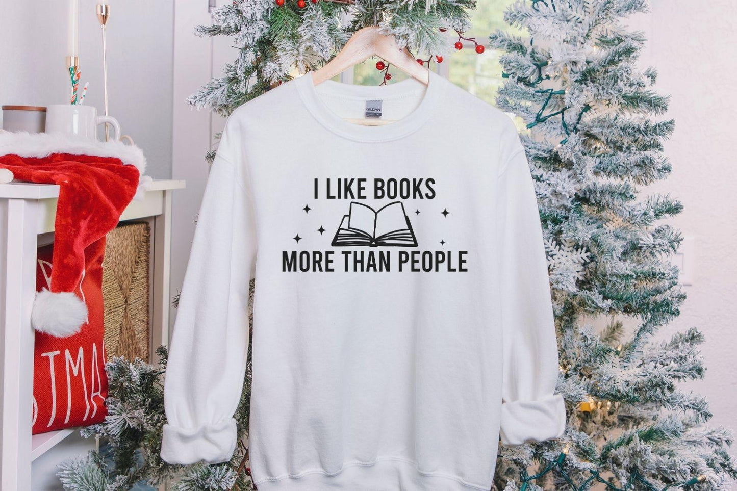 A Gildan 18000 sweatshirt with the saying "I like books more than people"