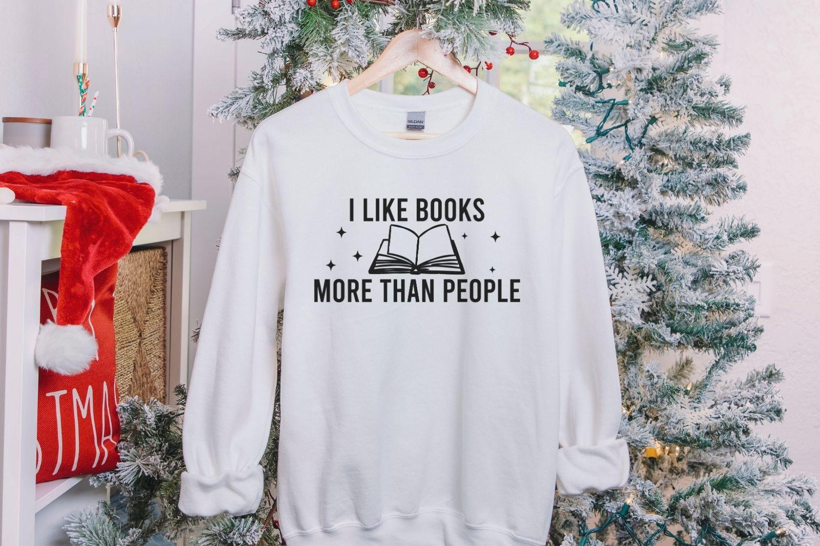 A Gildan 18000 sweatshirt with the saying "I like books more than people"