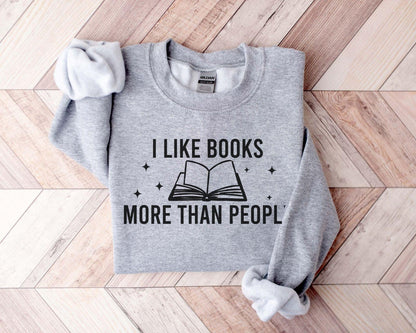 A Gildan 18000 sweatshirt with the saying "I like books more than people"