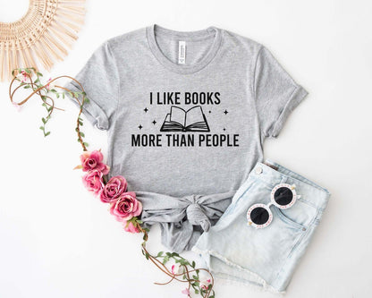A comfort colors® shirt with the saying "I like books more than people"