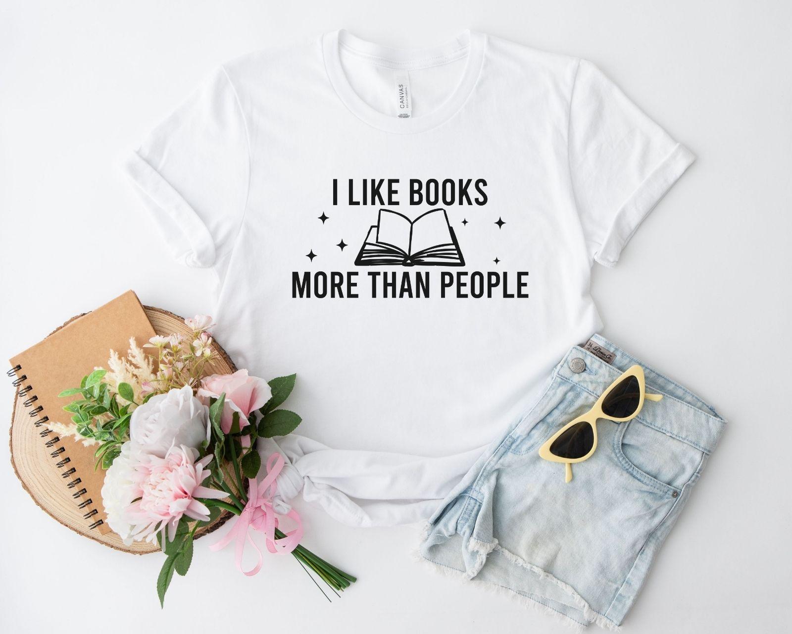 A comfort colors® shirt with the saying "I like books more than people"