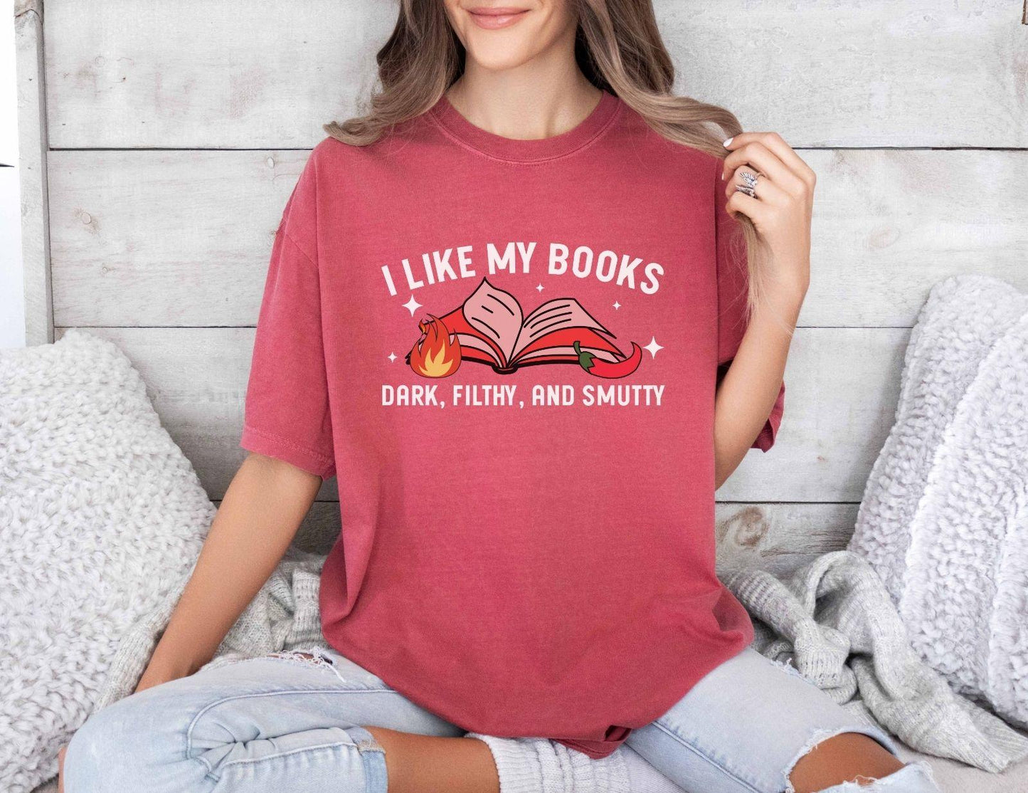 A comfort colors shirt with the saying "I like my books dark filthy and smutty"