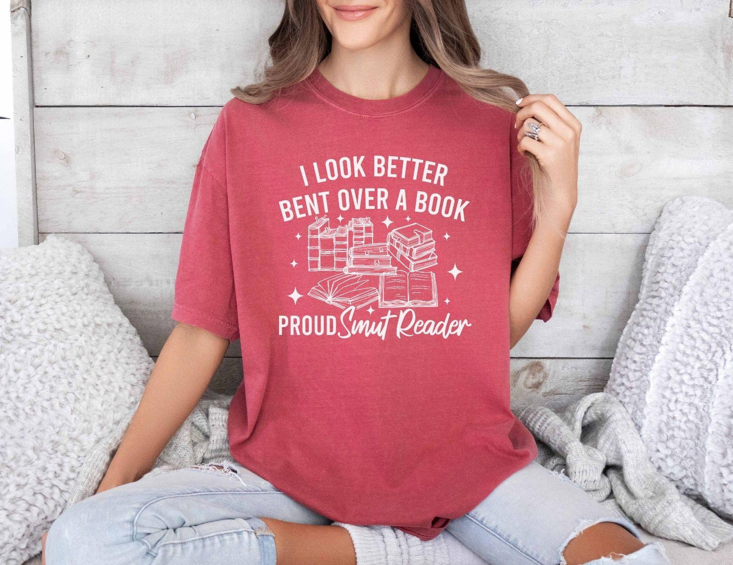 A comfort colors shirt with the saying "I look better bent over a book proud smut reader"